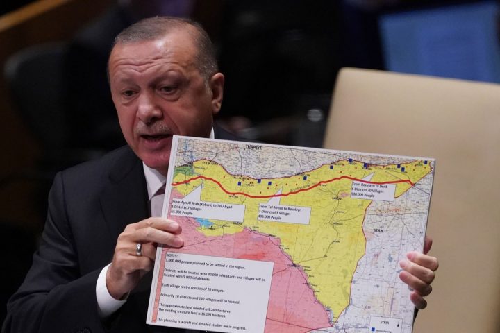 Turkey's President Recep Tayyip Erdogan holds up a map as he speaks during the 74th Session of the United Nations General Assembly at UN Headquarters in New York, September 24, 2019. (Photo by TIMOTHY A. CLARY / AFP)